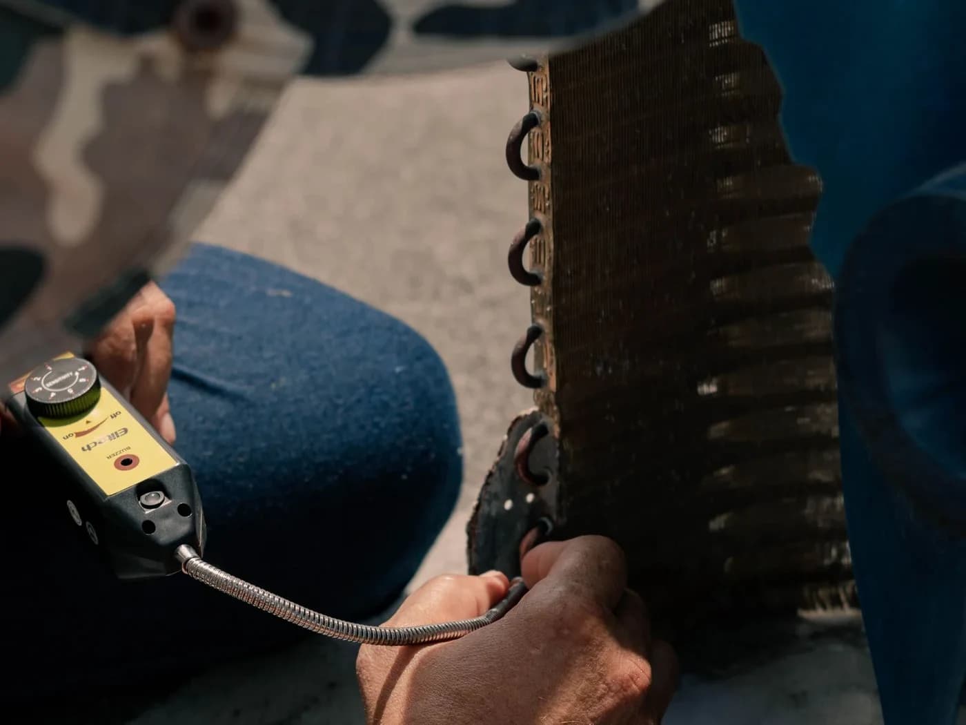 Technician servicing an air conditioner in Gurgaon